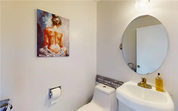 a bathroom with a toilet and a sink
