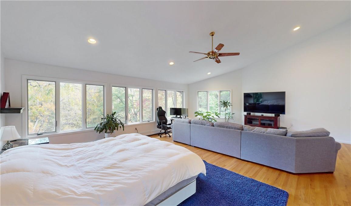 96 Old Pascack Road Pearl River, NY 10965 - Photo 18 of 36 a bedroom with a bed and a flat screen tv