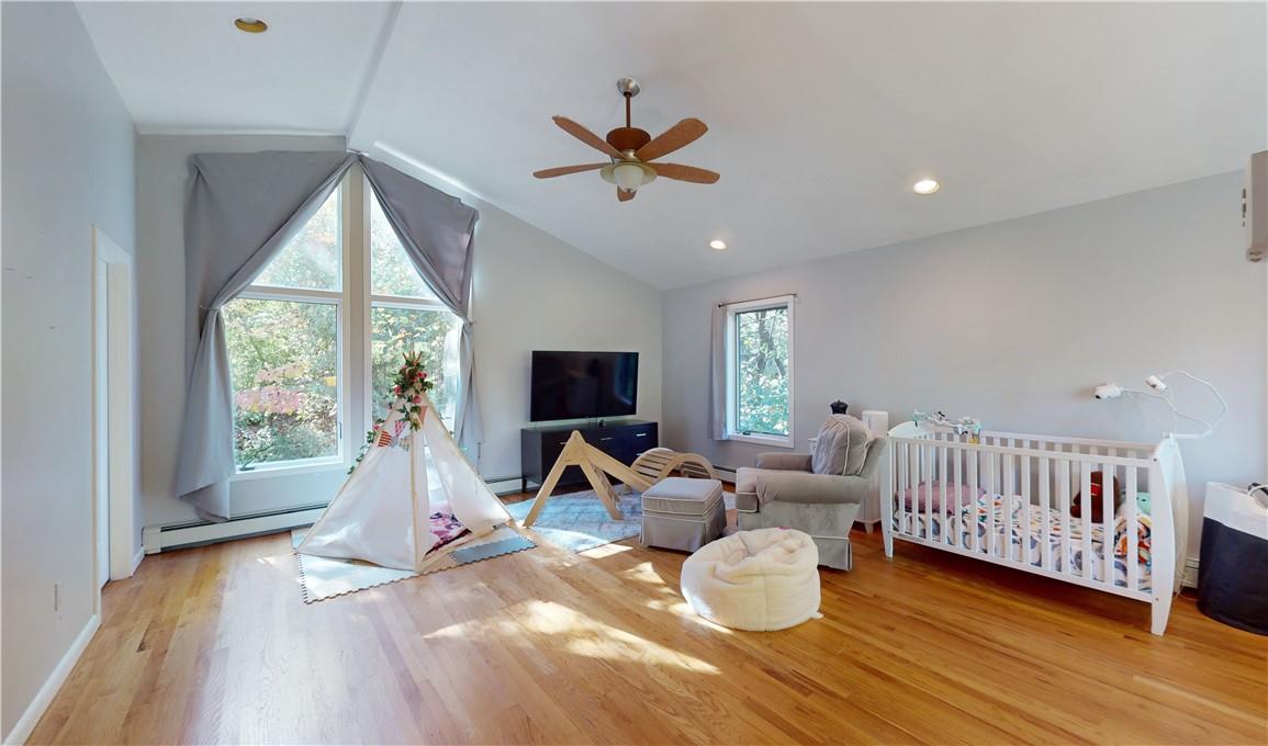 96 Old Pascack Road Pearl River, NY 10965 - Photo 20 of 36 a living room with furniture and a flat screen tv