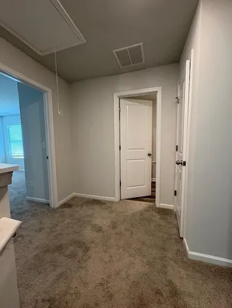 an empty room with closet area