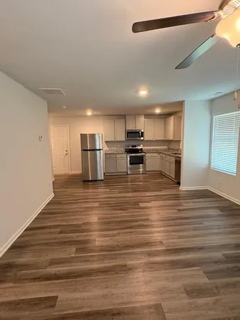 a view of kitchen and wooden floor