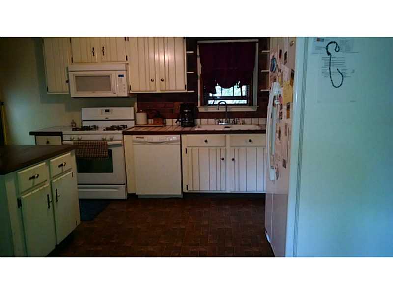 161 Colonial Road Burrillville, RI 02830 - Photo 13 of 22 Kitchen. Choice of new color granite counter tops upon accepted offer! 3 yr old appliances to stay. Island and counter with access to dining room.