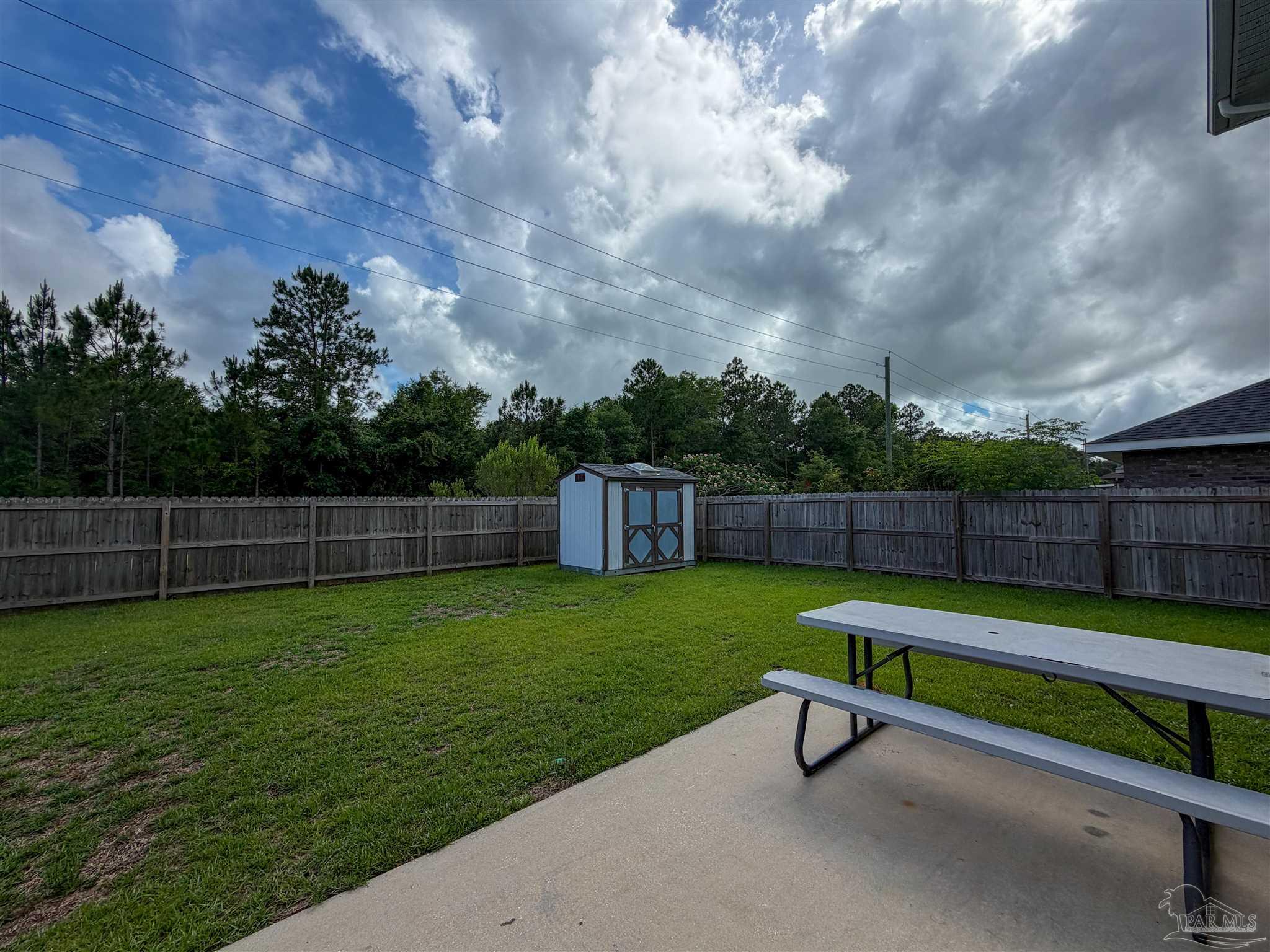 3613 Conley Drive Cantonment, FL 32533 - Photo 30 of 32 a garden view with a bench