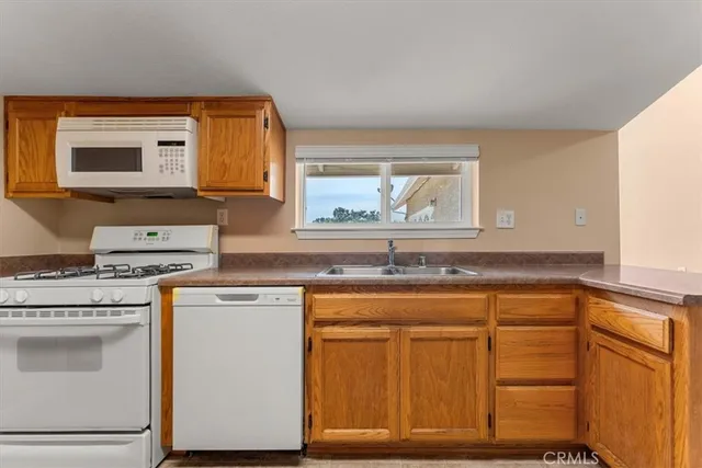a kitchen with sink and cabinets