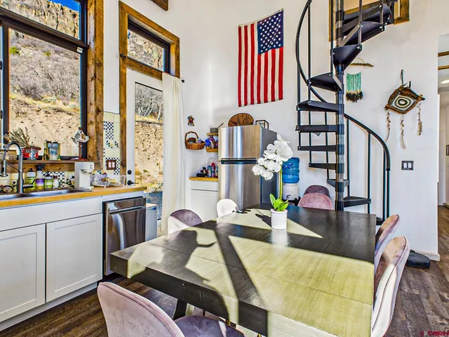 a very nice looking living room with a large window