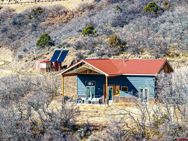 a view of house with yard