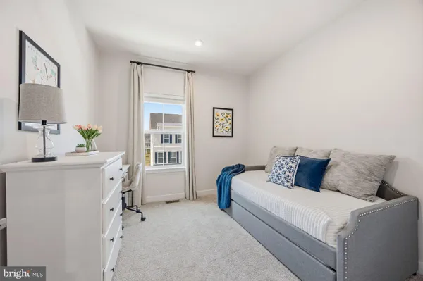 a bed room with a bed furniture and a window