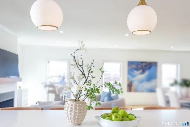 a view of a vase of flowers sitting on a table