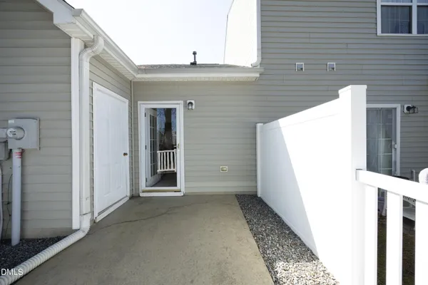 a view of a house with a door and wooden floor