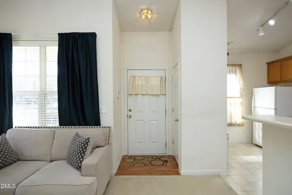 a living room with a couch and a window