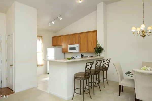 a kitchen with stainless steel appliances a sink and cabinets