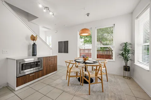 a view of a dining room with furniture window and outside view