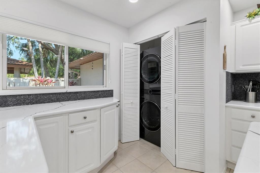 6304 Pelican Drive Bradenton, FL 34210 - Photo 11 of 42 a kitchen with a refrigerator and window