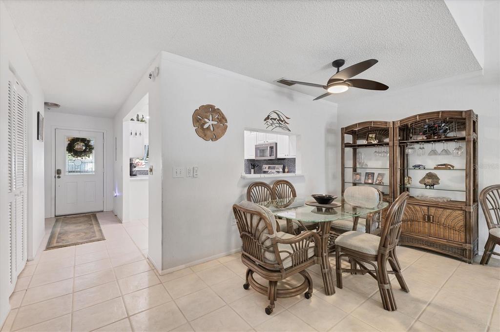 6304 Pelican Drive Bradenton, FL 34210 - Photo 12 of 42 a dining room with furniture and window