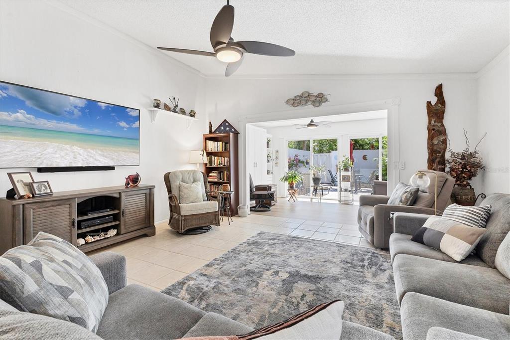 6304 Pelican Drive Bradenton, FL 34210 - Photo 16 of 42 a living room with furniture window and a fireplace