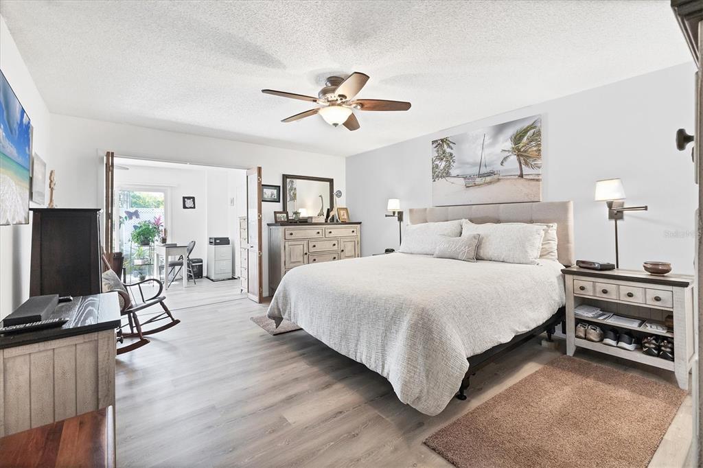 6304 Pelican Drive Bradenton, FL 34210 - Photo 18 of 42 a bedroom with bed and a flat tv screen on dresser