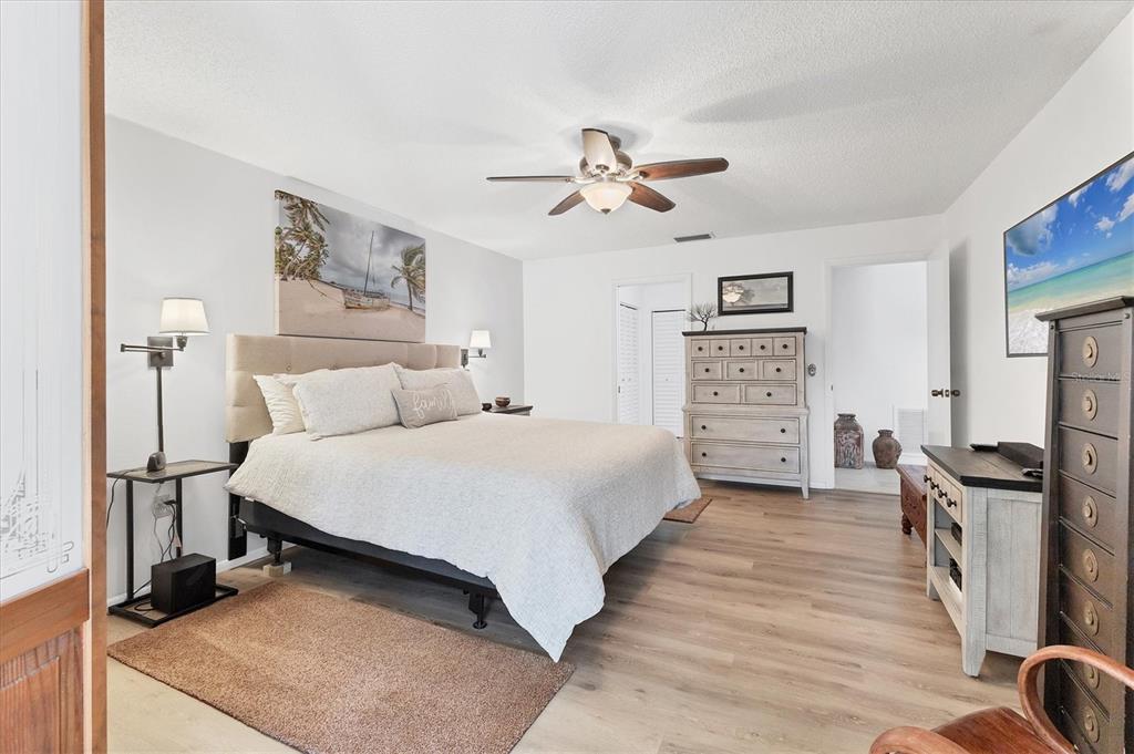 6304 Pelican Drive Bradenton, FL 34210 - Photo 19 of 42 a bedroom with a bed and a refrigerator