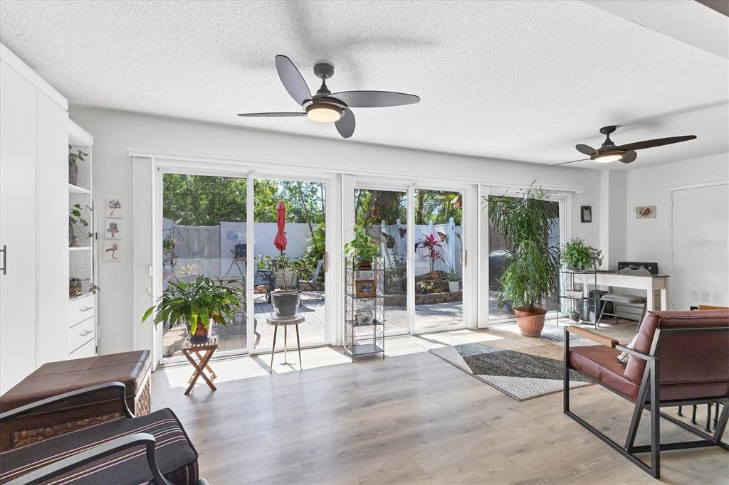 6304 Pelican Drive Bradenton, FL 34210 - Photo 26 of 42 a living room with furniture potted plant and a large window