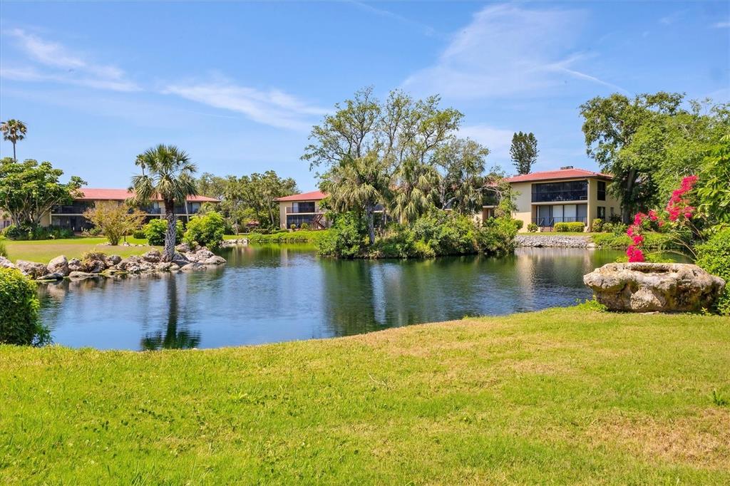 6304 Pelican Drive Bradenton, FL 34210 - Photo 34 of 42 a swimming pool with barbeque oven and outdoor seating