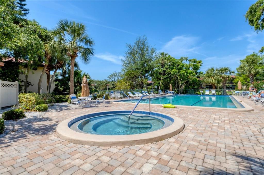 6304 Pelican Drive Bradenton, FL 34210 - Photo 37 of 42 a view of a swimming pool with a yard