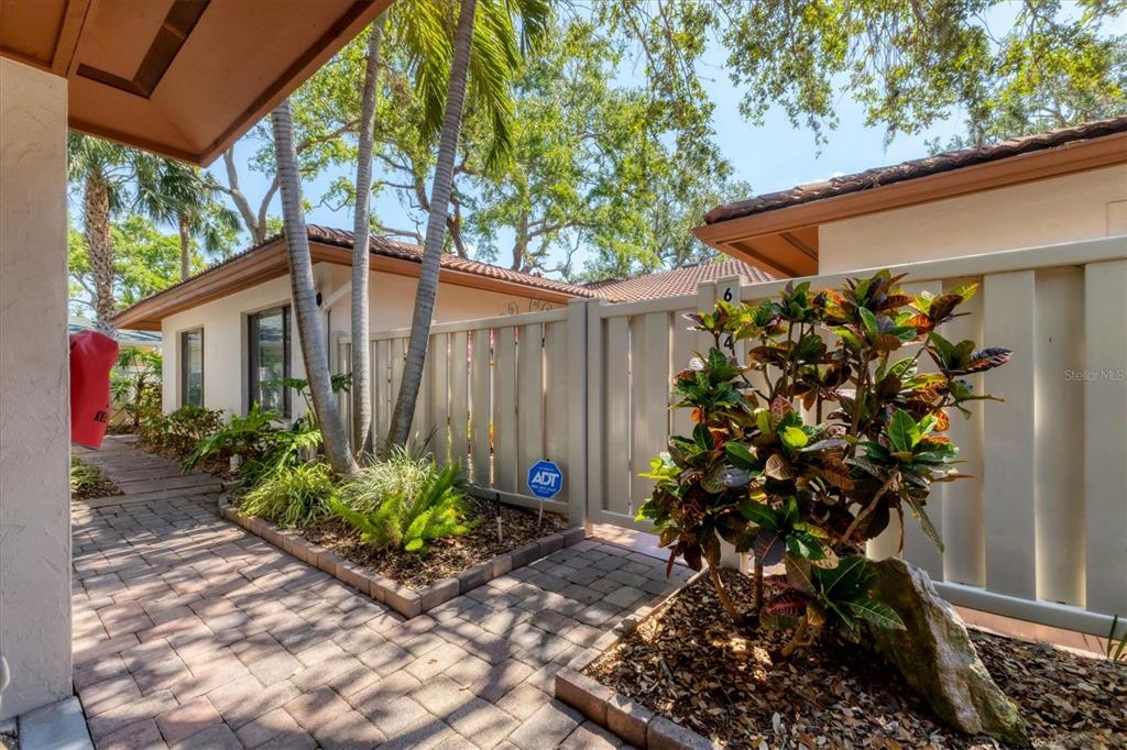 6304 Pelican Drive Bradenton, FL 34210 - Photo 4 of 42 a house with flowers in front of it