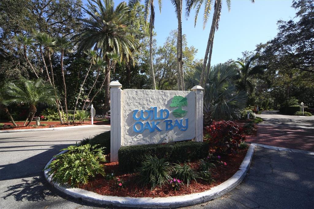 6304 Pelican Drive Bradenton, FL 34210 - Photo 42 of 42 a sign that is sitting in front of flowers