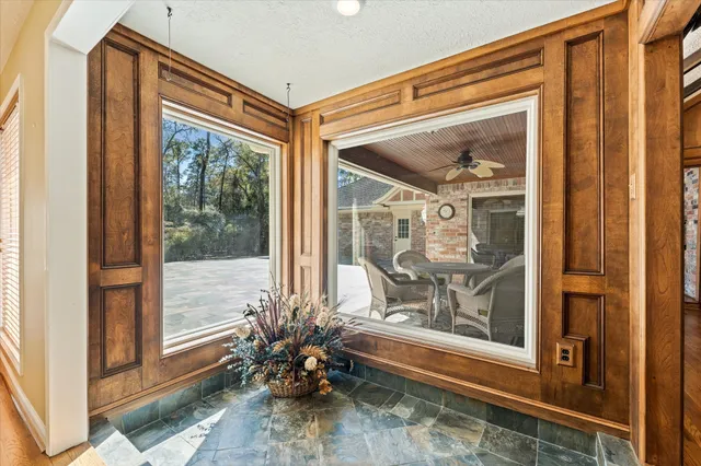 a front view of a house with a glass door and glass door