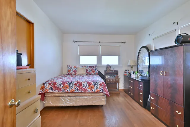 a bed room with a bed and window