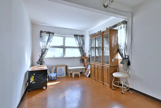 a room with gym equipment and a window