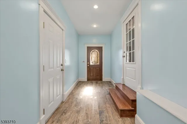 a view of gallery with wooden floor