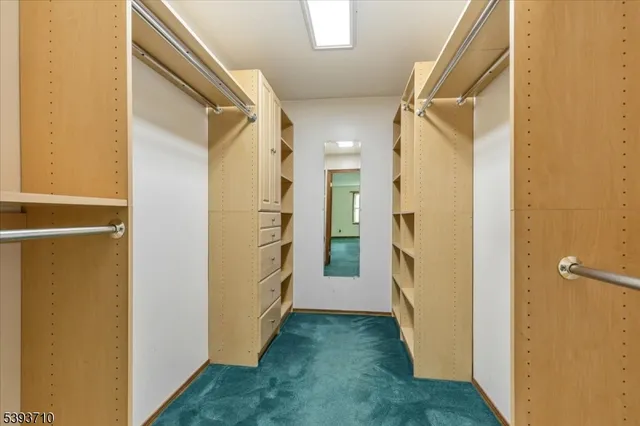 a view of a hallway with a refrigerator