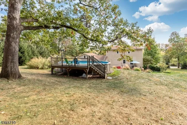 a view of car parked in front of house with trees