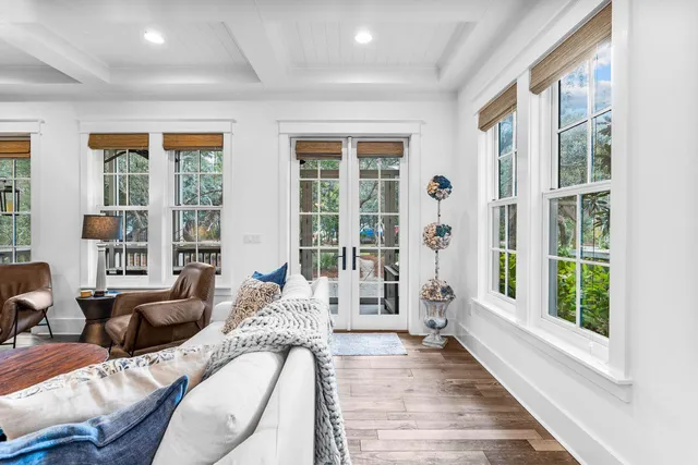 a bedroom with two beds and a large window