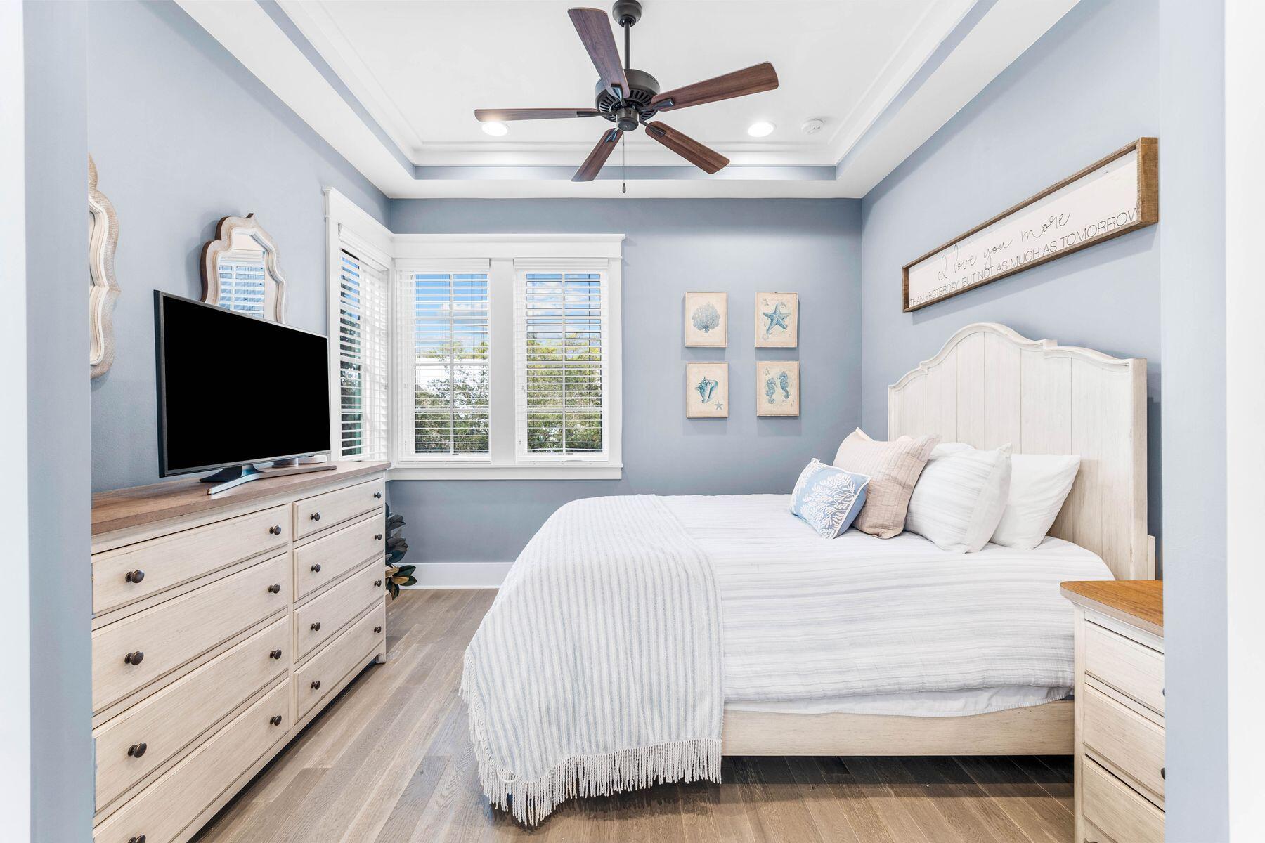 79 Cedar Post Road Santa Rosa Beach, FL 32459 - Photo 15 of 55 a bedroom with a bed flat screen tv and a window