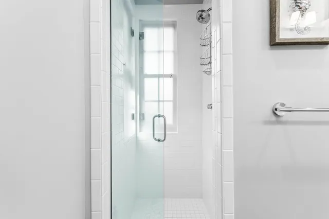 a room with wooden floor table and chairs