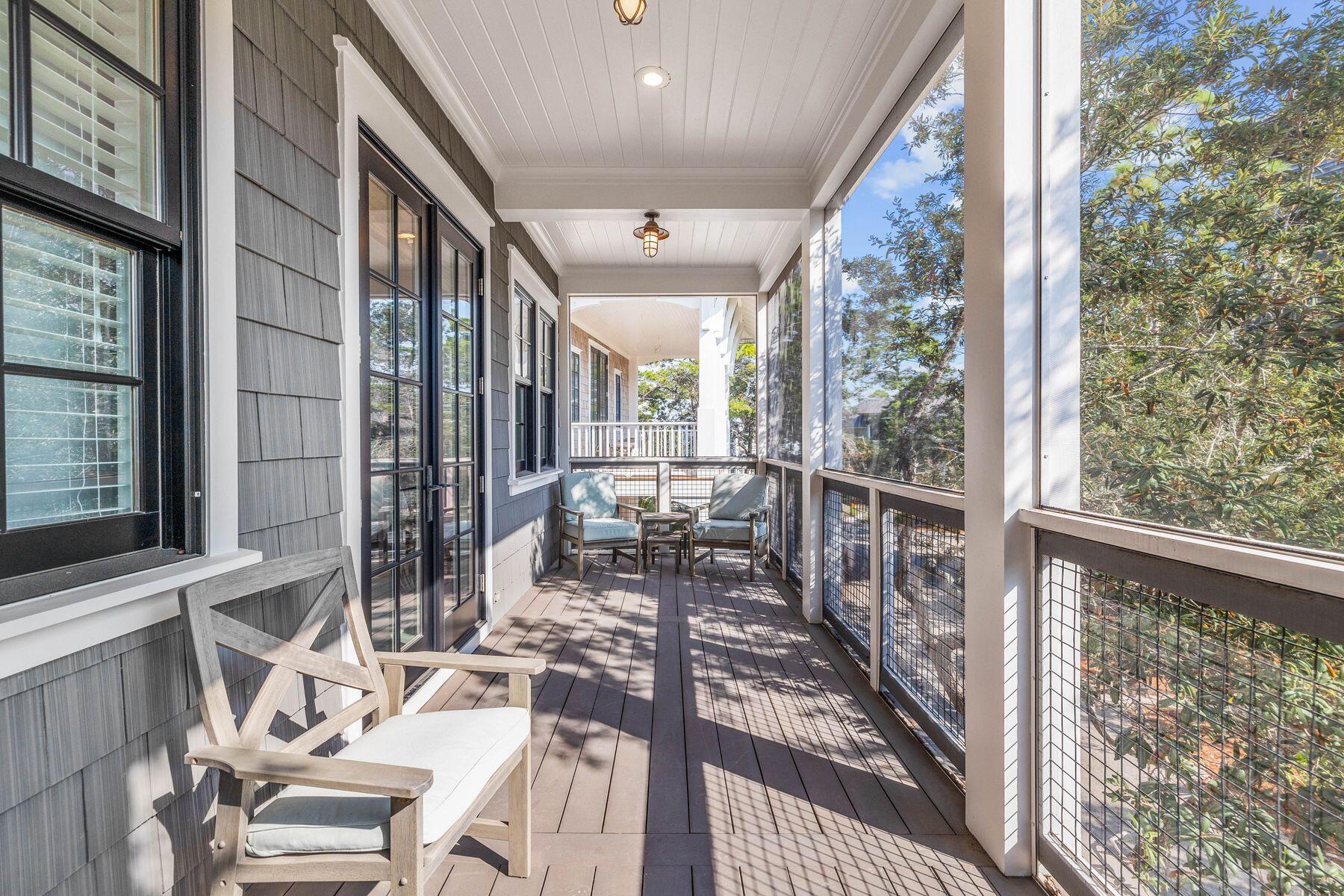 79 Cedar Post Road Santa Rosa Beach, FL 32459 - Photo 21 of 55 a view of a porch with chairs and backyard