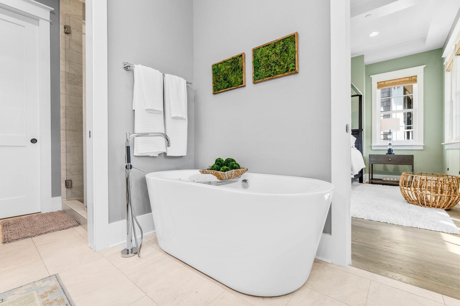 79 Cedar Post Road Santa Rosa Beach, FL 32459 - Photo 26 of 55 a white bath tub sitting in a bathroom next to a window