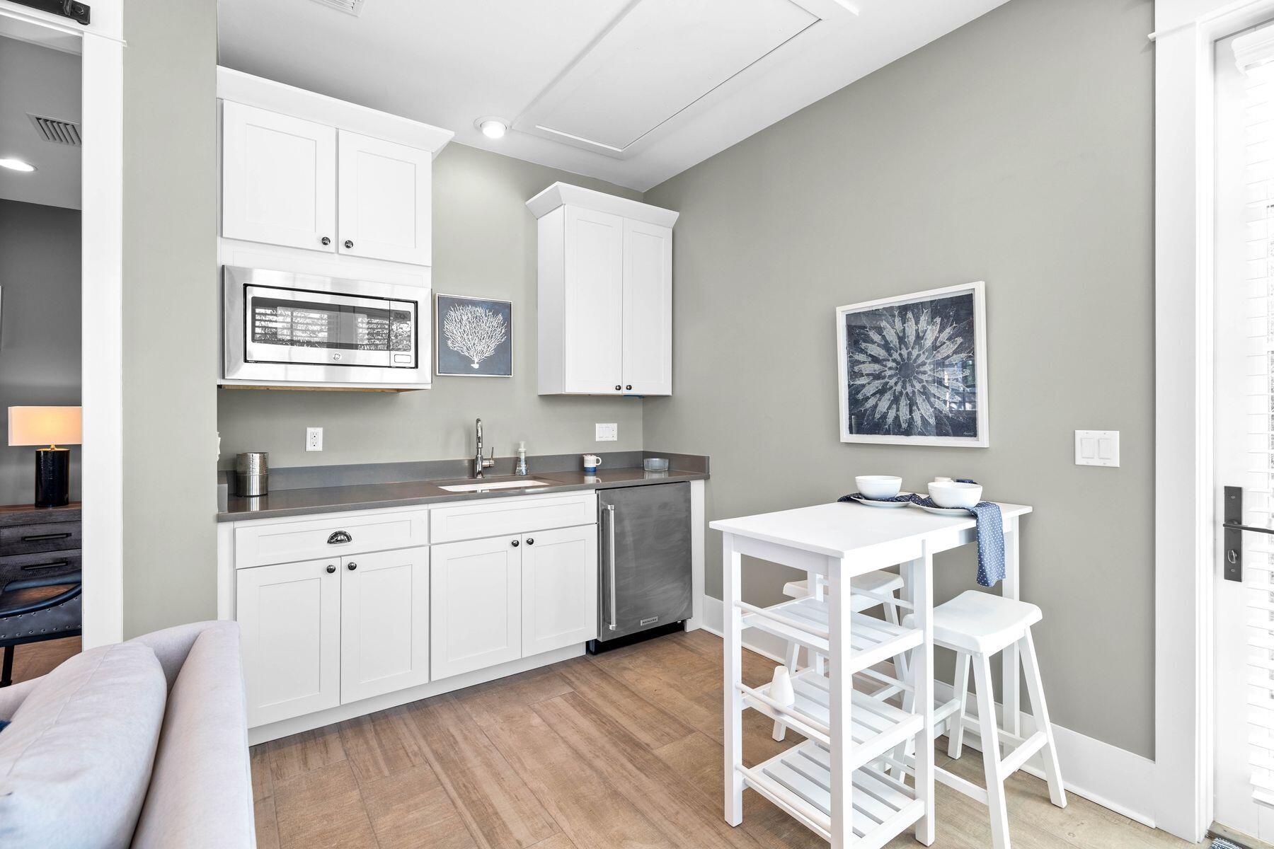 79 Cedar Post Road Santa Rosa Beach, FL 32459 - Photo 34 of 55 a kitchen with a sink cabinets and wooden floor