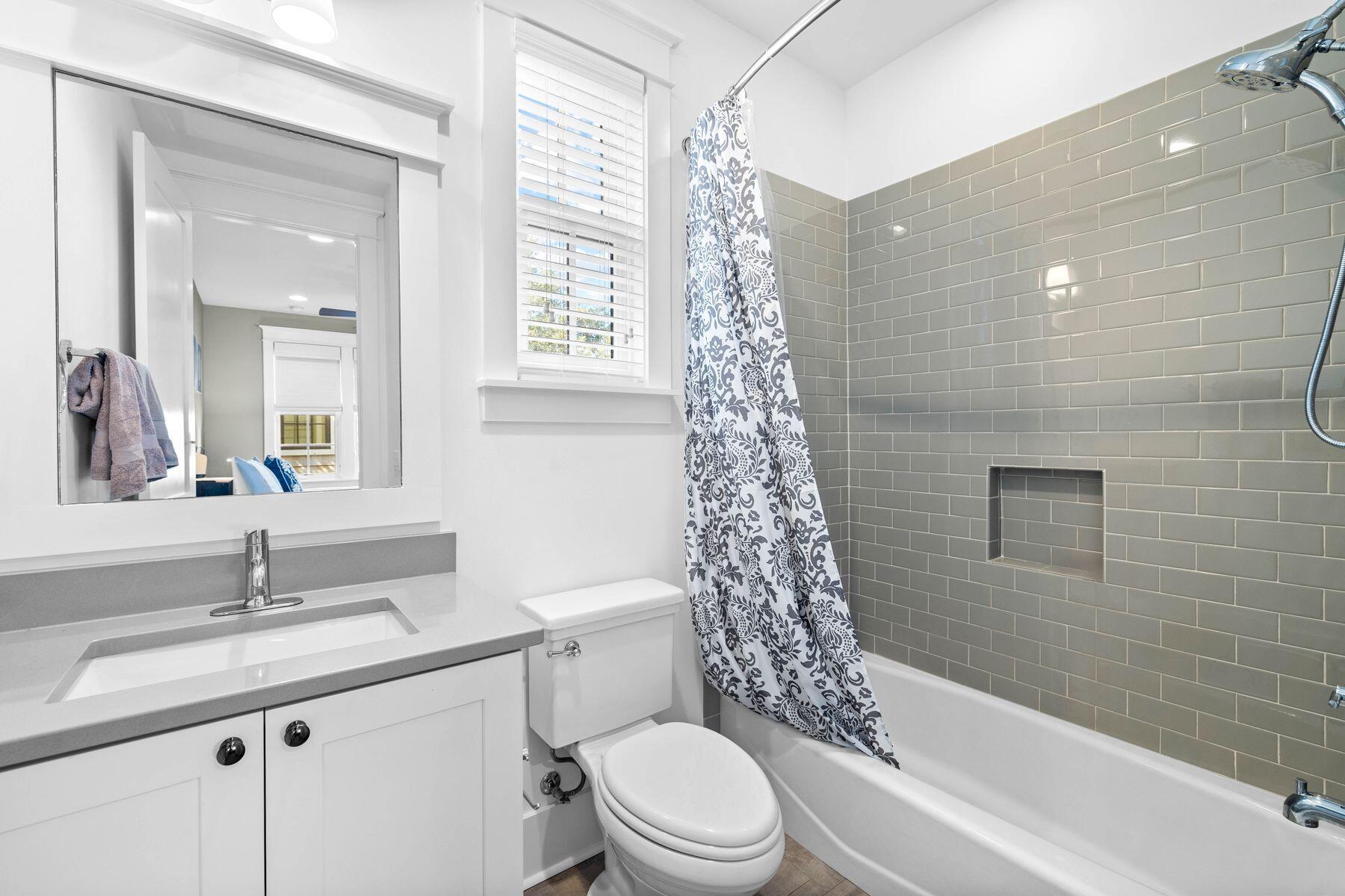 79 Cedar Post Road Santa Rosa Beach, FL 32459 - Photo 39 of 55 a bathroom with a granite countertop sink a toilet and shower