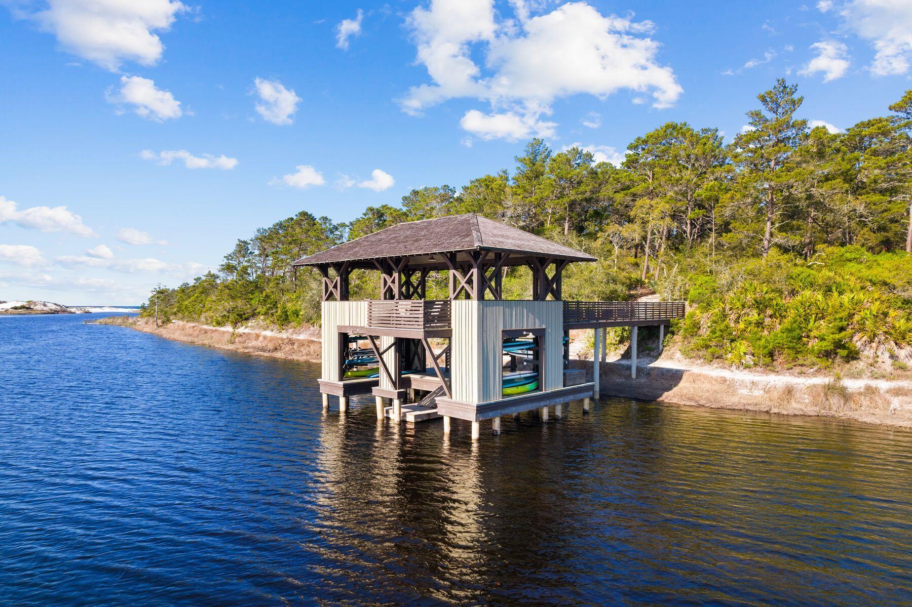 79 Cedar Post Road Santa Rosa Beach, FL 32459 - Photo 47 of 55 a view of a patio with table and chairs with wooden floor