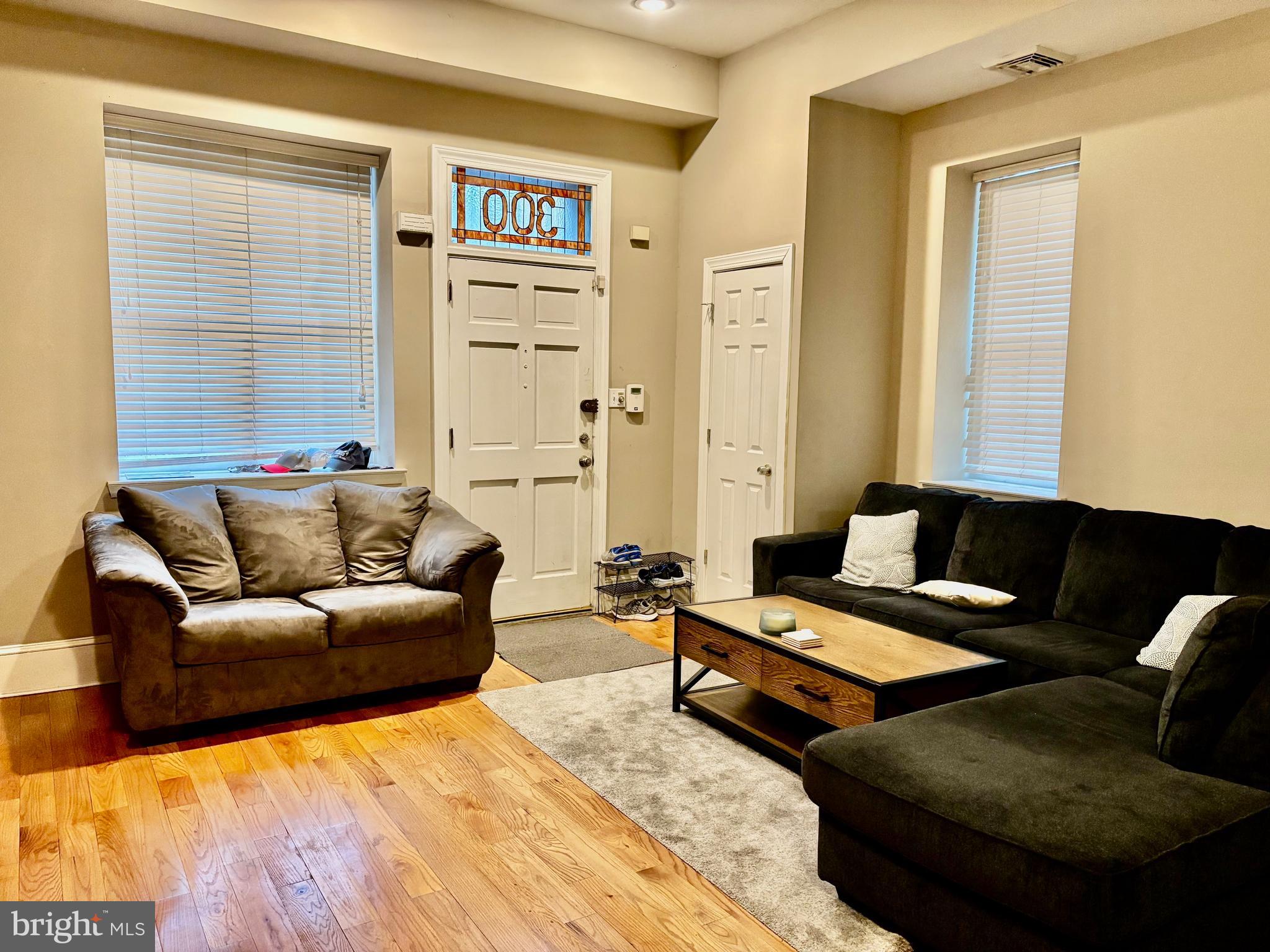 300 Lombard Street Philadelphia, PA 19147 - Photo 3 of 14 a living room with furniture and a large window