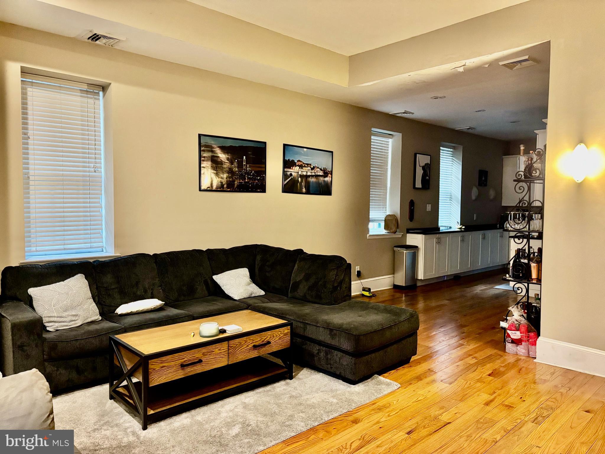300 Lombard Street Philadelphia, PA 19147 - Photo 5 of 14 a living room with furniture and wooden floor