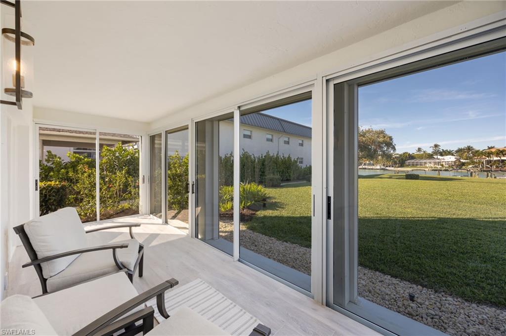 383 Harbour Drive, Unit 101 Naples, FL 34103 - Photo 18 of 30 Enjoy morning coffee or evening wine from huge lanai