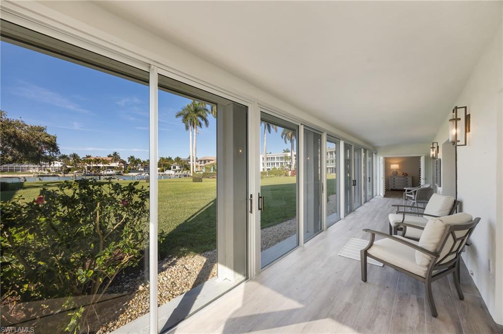 383 Harbour Drive, Unit 101 Naples, FL 34103 - Photo 19 of 30 Huge sun room runs along the length of the unit