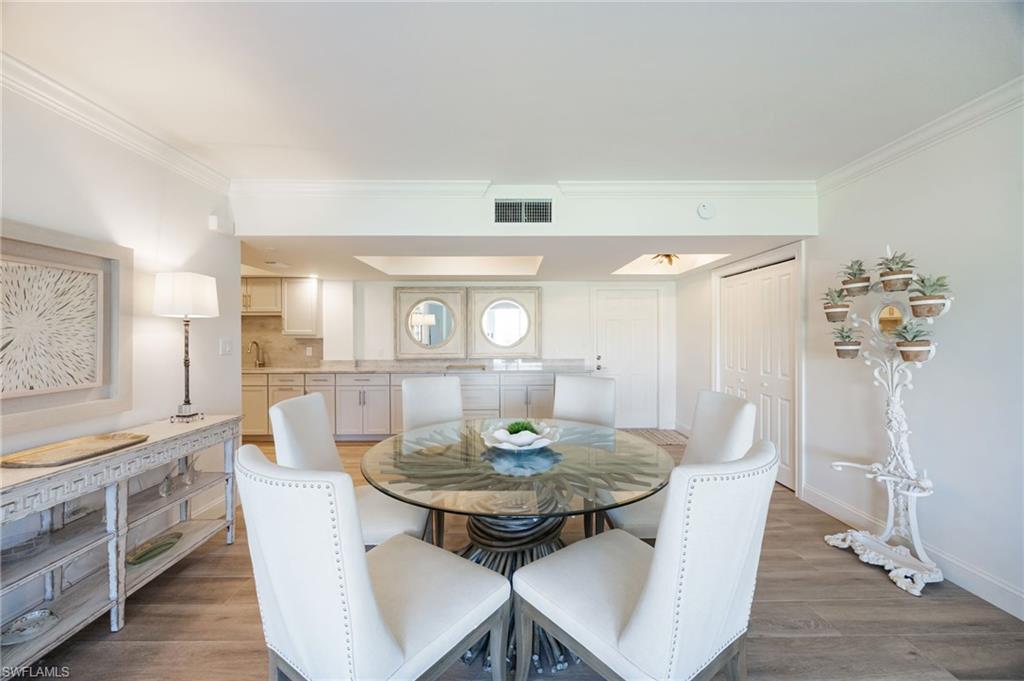 383 Harbour Drive, Unit 101 Naples, FL 34103 - Photo 2 of 30 Spacious dining with counter serving area