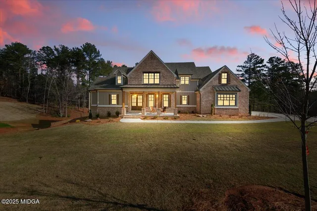 a front view of a house with a yard