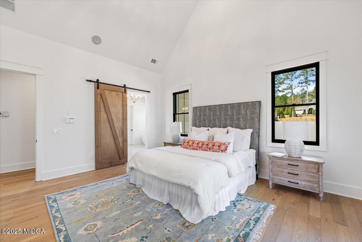 104 Piedmont Circle Forsyth, GA 31029 - Photo 14 of 42 a bedroom with a bed and a couch