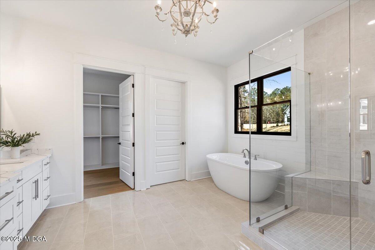 104 Piedmont Circle Forsyth, GA 31029 - Photo 15 of 42 a spacious bathroom with a bathtub and a shower