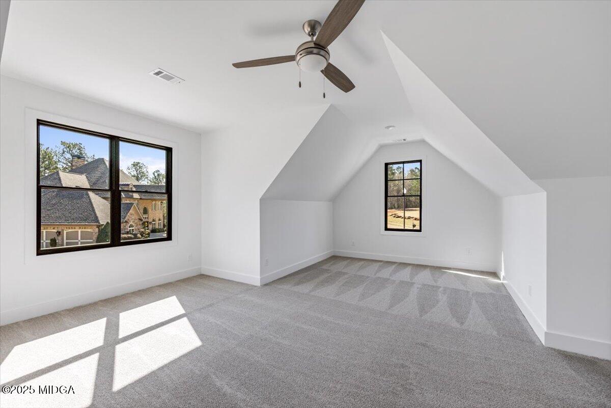 104 Piedmont Circle Forsyth, GA 31029 - Photo 28 of 42 an empty room with windows and fan