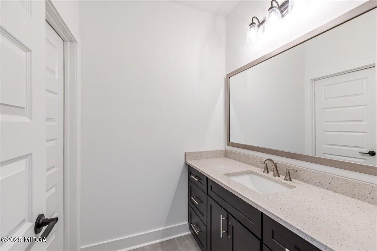 104 Piedmont Circle Forsyth, GA 31029 - Photo 30 of 42 a bathroom with a sink and a mirror